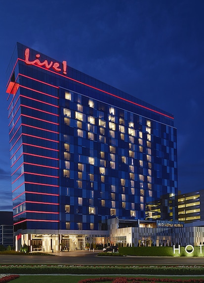 Hotels: The sparkling Live! logo and distinctive red floor lights illuminate the night sky. Check out more Live! hotels.